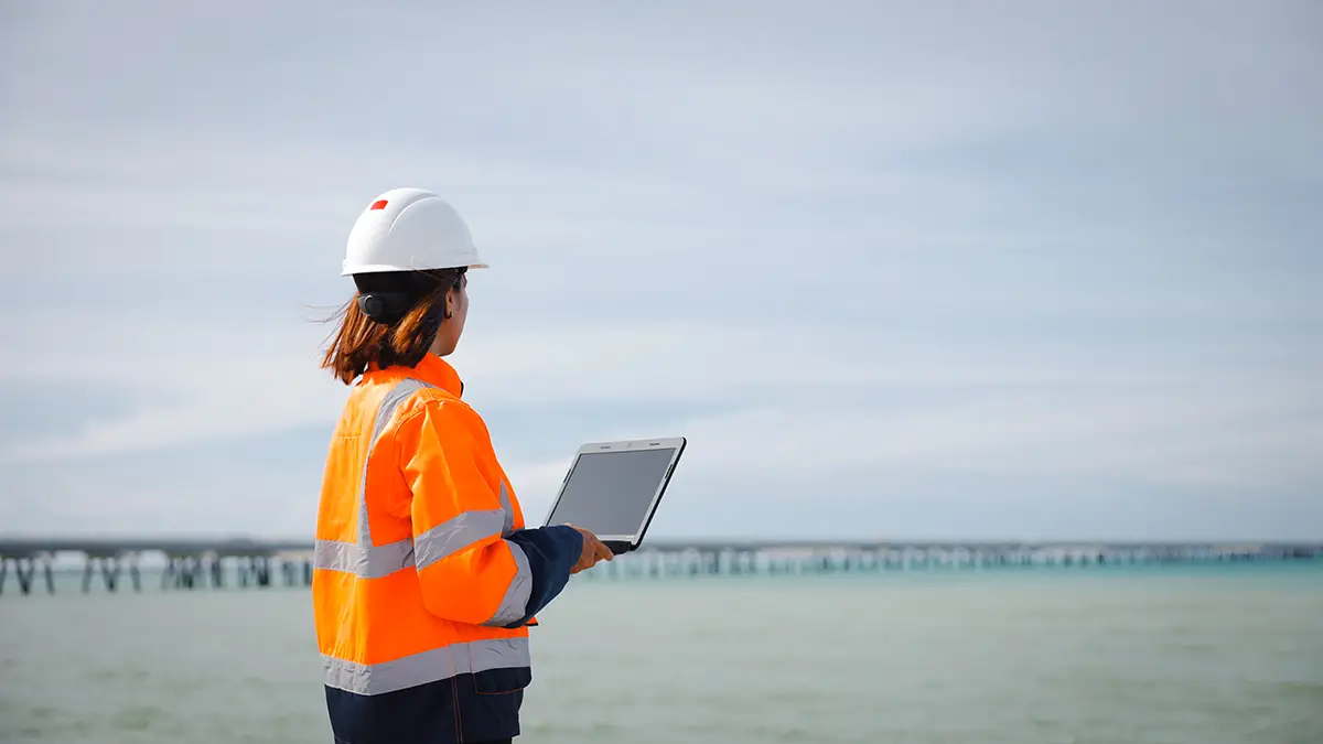 Hero-Banner-Bg-Img-11 Energy project professional conducting offshore site assessment for interconnector infrastructure development.